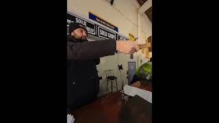 Auctioneer selling bangers for cash at UK car auction
