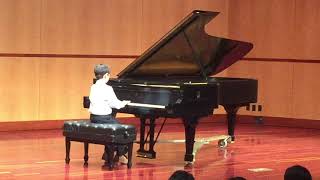 beginner piano student performing