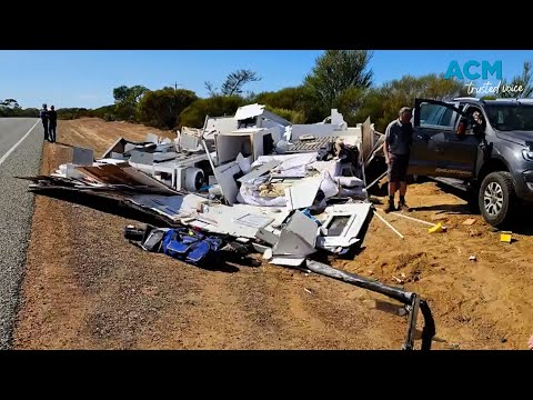 Caravan smashed to pieces after collision with truck