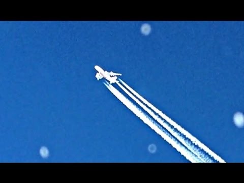 Airbus A380 airplane fly by with contrails