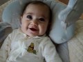 Alia Juliet Very Happy In Her Swing Watching Sesame Street