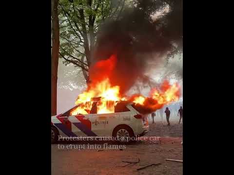 Rioters attack police in anti-migrant protests in The Hague