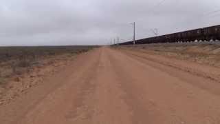 preview picture of video 'South Africa, cycling alongside the longest train in the world. 4,1kms and a lot of noise!!'