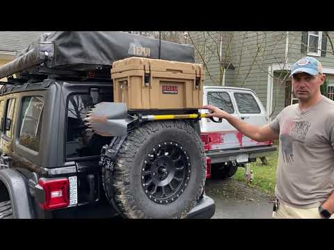 Spare tire cargo carrier for a shovel and a roam box