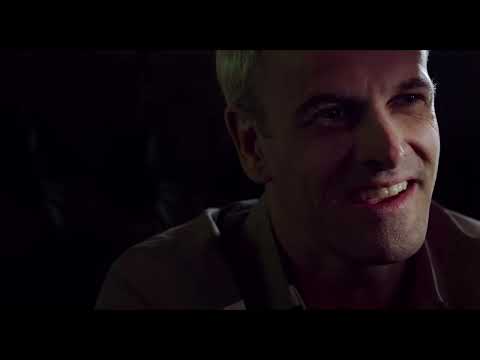 T2 Trainspotting trailer frame with the four returning leads walking under orange title bars