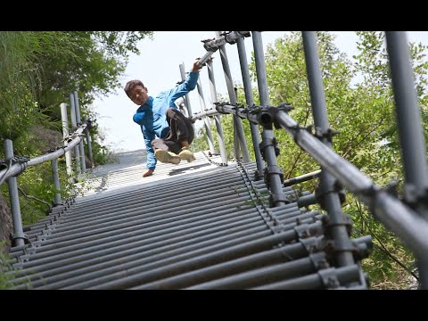 Villagers climb down from cliffs and out of poverty