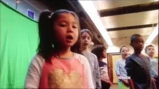 Elizabeth South sings "Let It Go" with her Durham Academy students on WNCN news