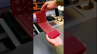 foldable Bluetooth keyboard with a touchpad and numeric keypad