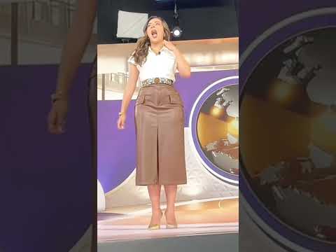 The beautiful news anchor Anna Lu and her handsome behind the scenes... enjoy their charm