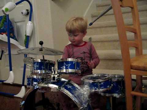 2 year old kid drummer LOGAN ROBOT GLADDEN playing and singing Queen We Will Rock You