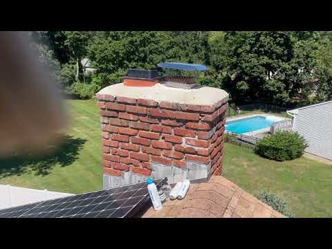 Yellow Jackets Make a Home in a Crack in the Chimney in Tinton Falls, NJ