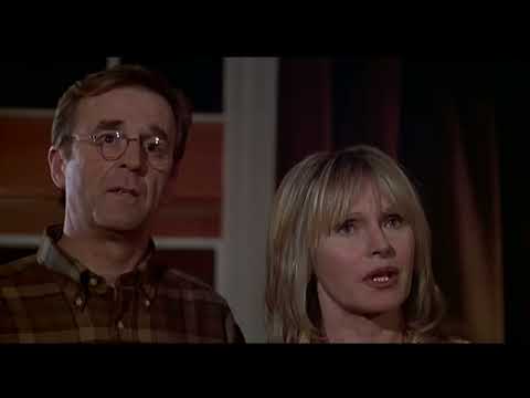 Trailer shot with coastal cliffs foreshadowing the ferry finale and score swells