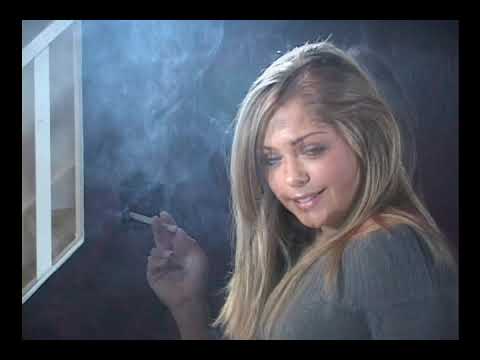 Beautiful blonde smokes an all white cigarette 