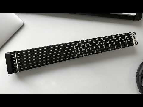 Minicorda Guitar. Suitcase-sized professional nylon guitar