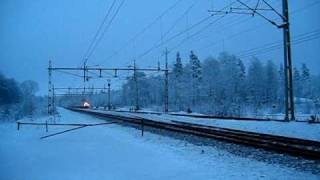 preview picture of video '[SJ] X2 to Göteborg C. passing ex. Källeryd station and level crossing.'