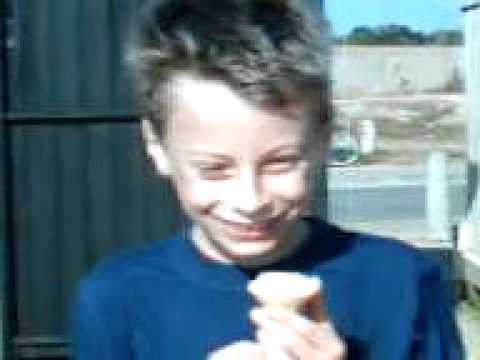 Naomi and Joshua eating ice cream at the seaside