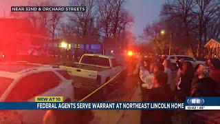 Federal agents serve warrant at northeast Lincoln residence, sparking outrage from bystanders
