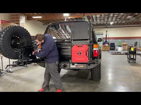 Dissent Off-Road, tire carrier swing arm with table. Easy open, slam shut.