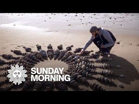 Artist Jon Foreman, whose canvas is a beach