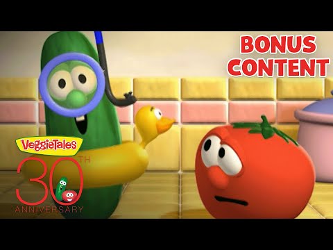 VeggieTales scene in a kitchen: a green cucumber with a yellow rubber duck and a red tomato looking at each other; 'BONUS CONTENT' banner in the corner.