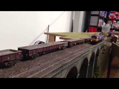 60006 passes on a long rake of MOA wagons while 66709 conti
