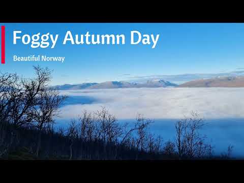 Beautiful day where fog covers the fjords and mountains around Tromso city in Northern Norway