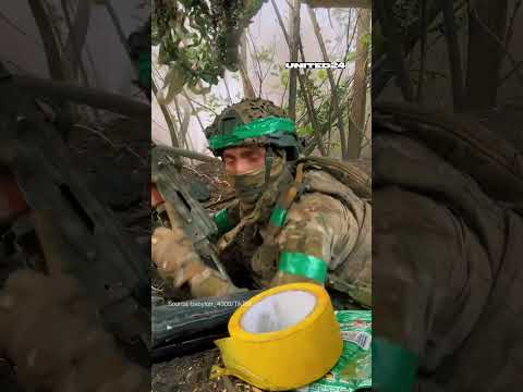 Ukrainian soldier filmed a Russian shell landing just next to his position #warinukraine #russia