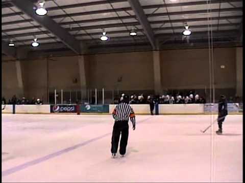 Hockey Player Checked over the boards into the opposing players bench