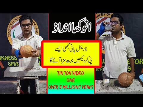 coconut breaking with hand with holding an egg