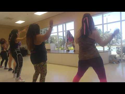 Yanelis Zumba instructor, Naples FL dancing Guachineo by Chocolate (Cuban rhythm)