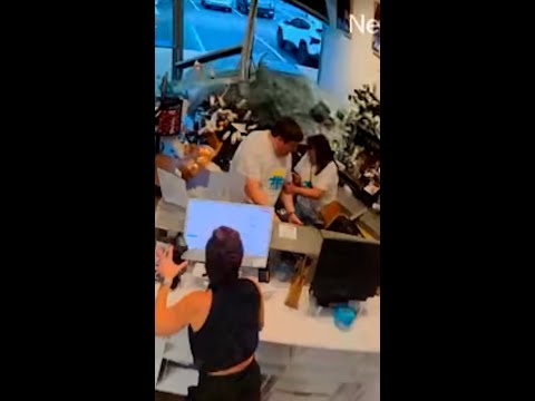 Couple survives car crashing into hair salon