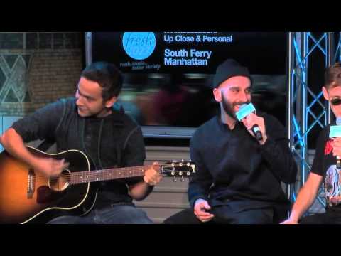 John McDermott playing guitar with the X-Ambassadors