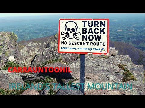 HIKING CARRAUNTOOHIL IRELAND'S TALLEST MOUNTAIN ON A SUNNY DAY.