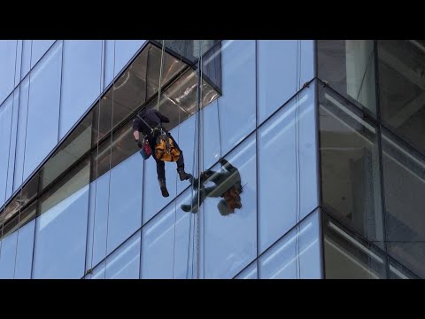 Two workers rescued from side of high-rise building in Vancouver