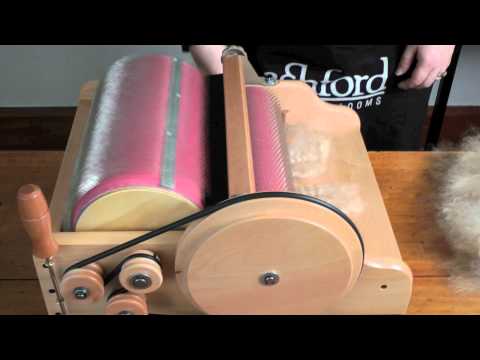 Carding fleece on an Ashford Drum Carder