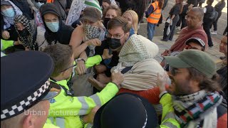 Scuffles ERUPT outside Excel Centre in London as protesters try to stop arms fair
