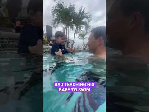 DAD TEACHES HIS SON TO SWIM