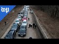Drone video shows Ukrainians fleeing to Poland
