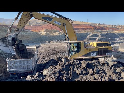 Caterpillar 365B Excavator Loading Mercedes & MAN Trucks