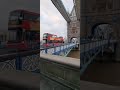 At The Middle Of The London Tower Bridge Tourist Bus Is Passing Through Tower Bridge