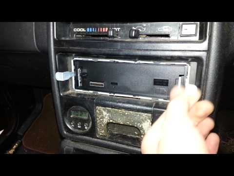 How to remove a kenwood radio from its mounting cradle.