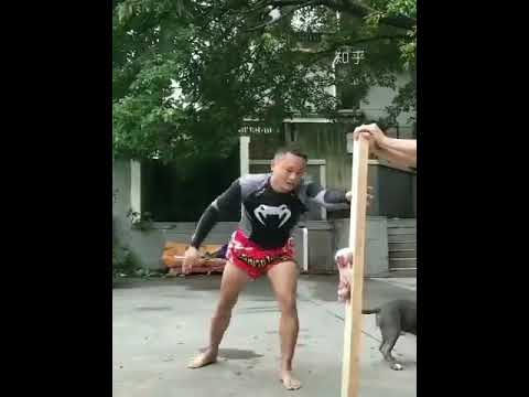 guy bends wrenches with powerful kicks