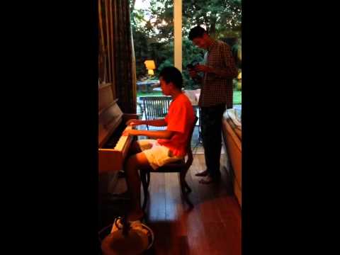 Alexandre Doan Van plays for his host family during the Windmill Cup