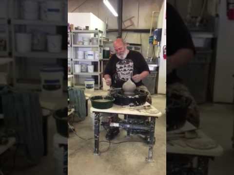 Don Ellis, shaping inside of a pot belly vase, wheel throwing demonstration