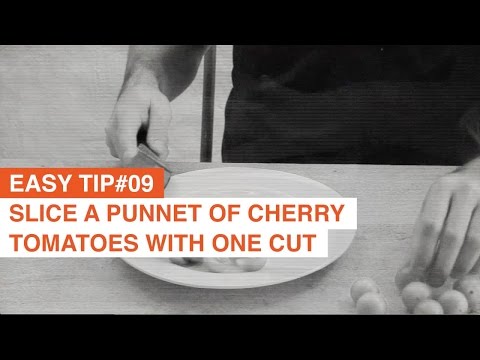 Slice a punnet of cherry tomatoes in one cut