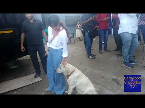 Debolina Bhattacharya playing with Dog.