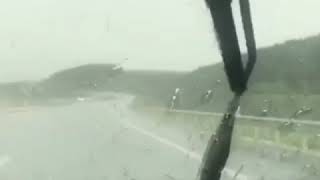 Alfa Romeo GT driving in the rain