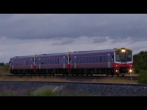 V/line Sprinter railcars at sunset - Passenger train at country level crossing - PoathTV