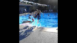 Ari jumping into the pool