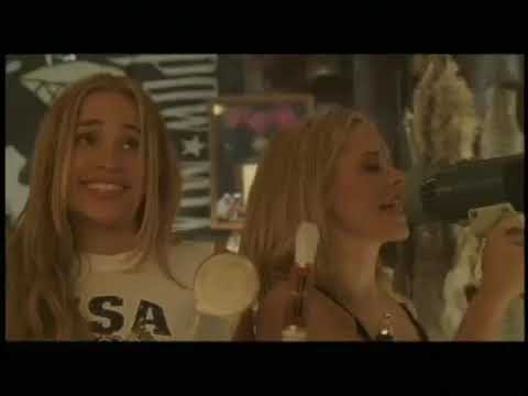 Coyote Ugly 2000 trailer still: Violet on the Coyote bar as the crowd roars, telegraphing hit-single energy